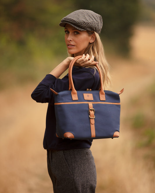 Handmade blue cotton canvas and tan leather handbag.
