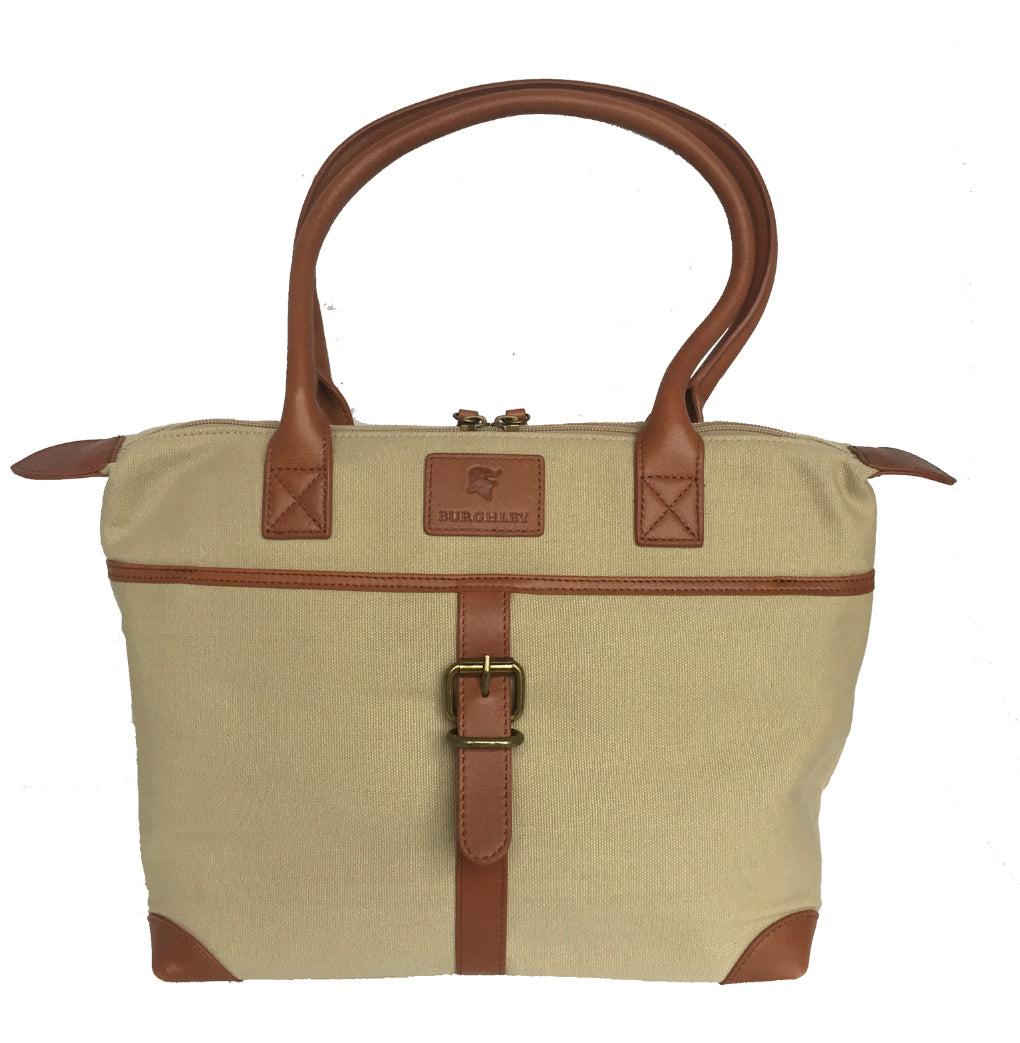 The Sedgebrook Handbag. A classic and timeless bag by Burghley Bags. Handmade from strong cotton canvas and leather. With strong leather handles it can be used as a shoulderbag. Shown in elegant cream.