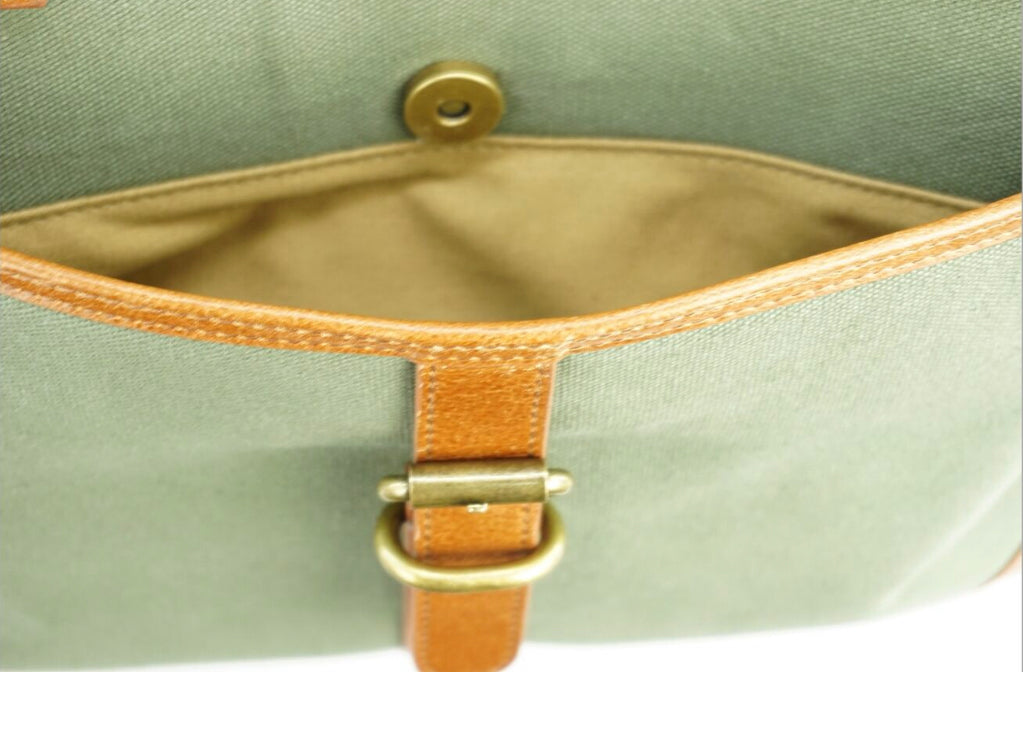 The Sedgebrook Handbag. A classic and timeless bag by Burghley Bags. Handmade from strong cotton canvas and leather. With strong leather handles it can be used as a shoulderbag. Front pocket shown.