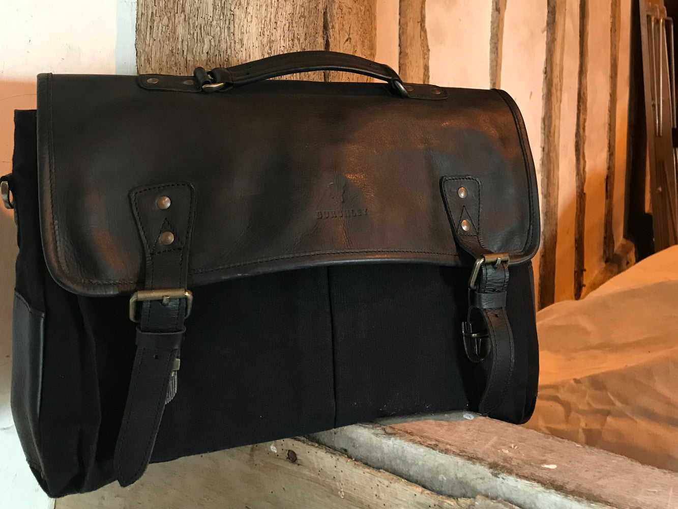 The Barholm. A contemporary handmade leather and canvas briefcase by Burghley Bags, in elegant matching black canvas and eco-friendly vegetable tanned black leather.