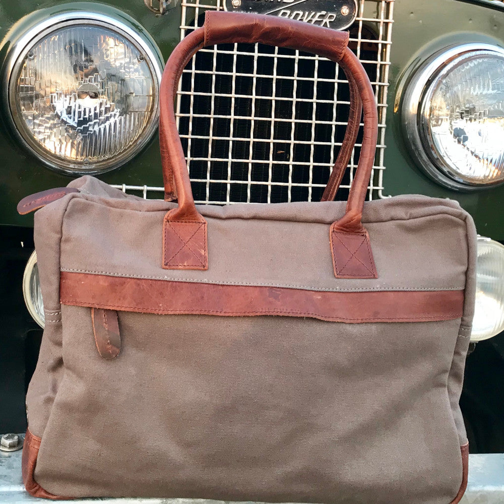 The Breton Briefcase. A casual work bag by Burghley Bags. Handmade from strong cotton canvas and supple leather.  Shown in soft grey.
