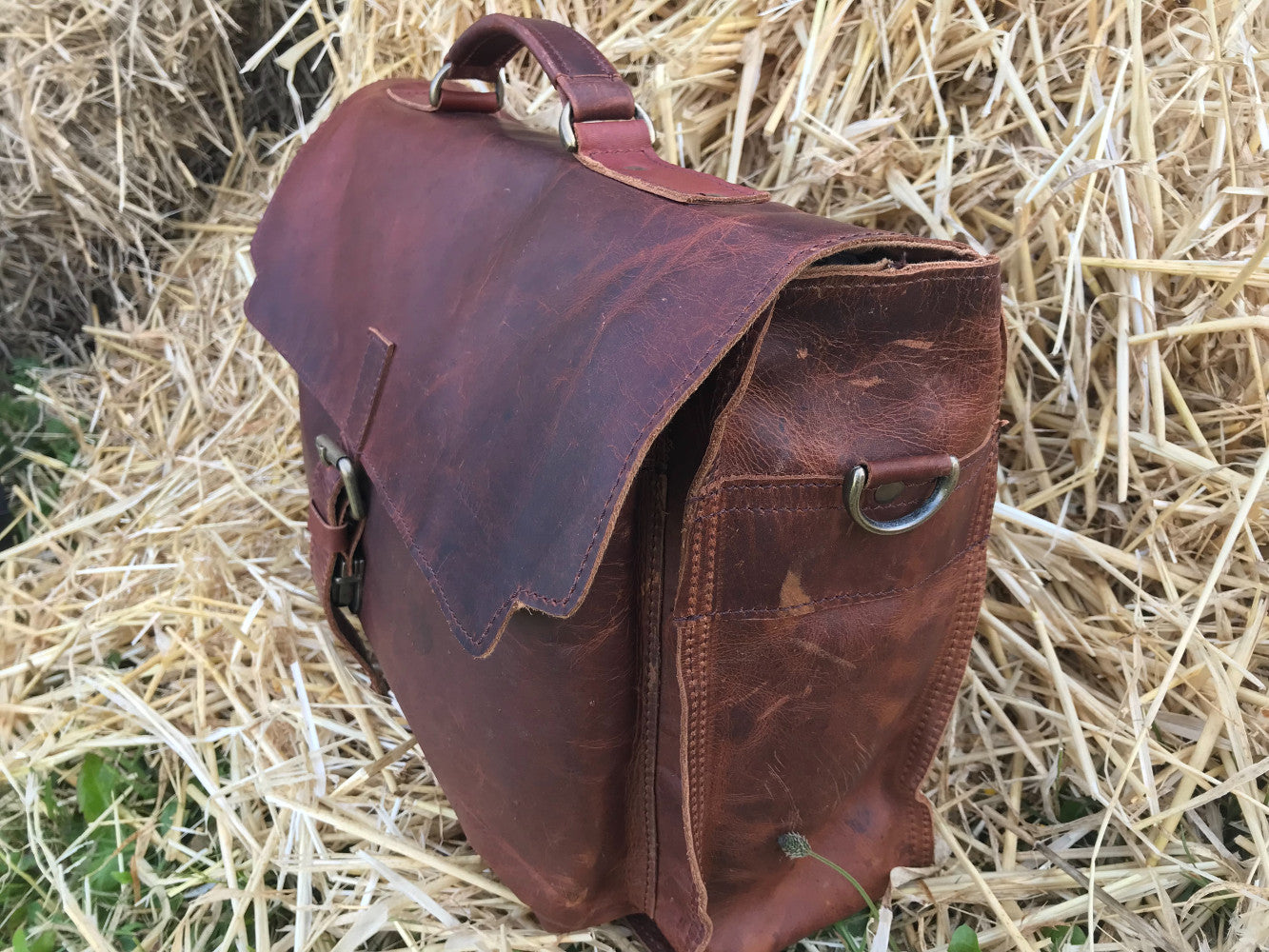 The Dorrington Briefcase. A classic 30's styled leather briefcase by Burghley Bags. A handmade leather vintage work bag, with enough space for 15" laptops. Comes with an adjustable and detachable shoulder strap. Shown in vintage brown.