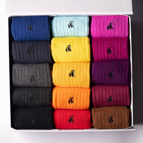 Box of colorful socks with a brand logo on a white background