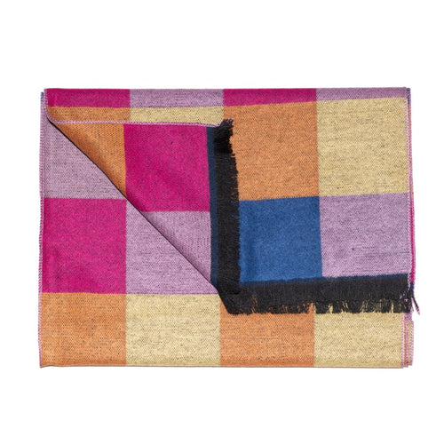 Colorful checkered blanket with a black fringe on a white background