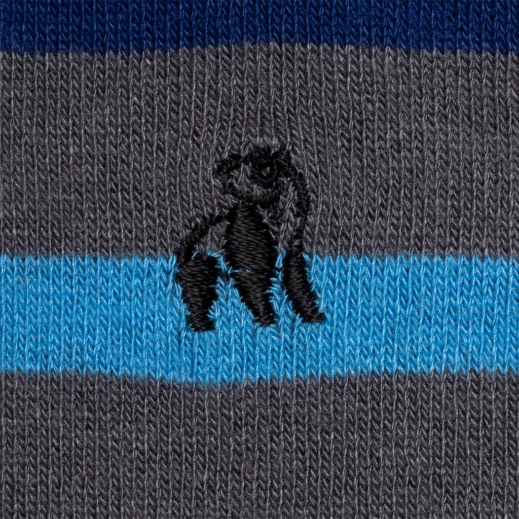 Striped sock with black panther design on gray and blue background