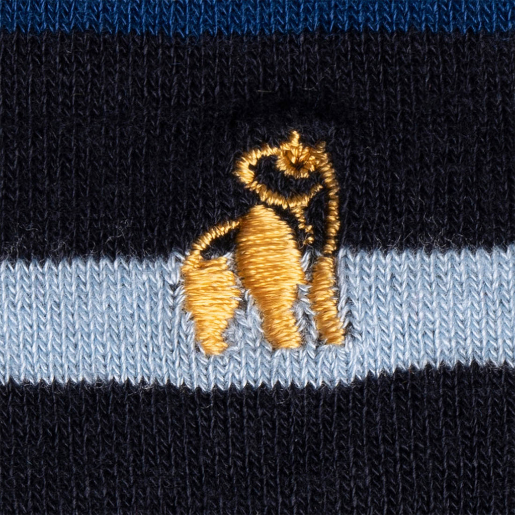 Embroidered dog design on a black and blue striped fabric background