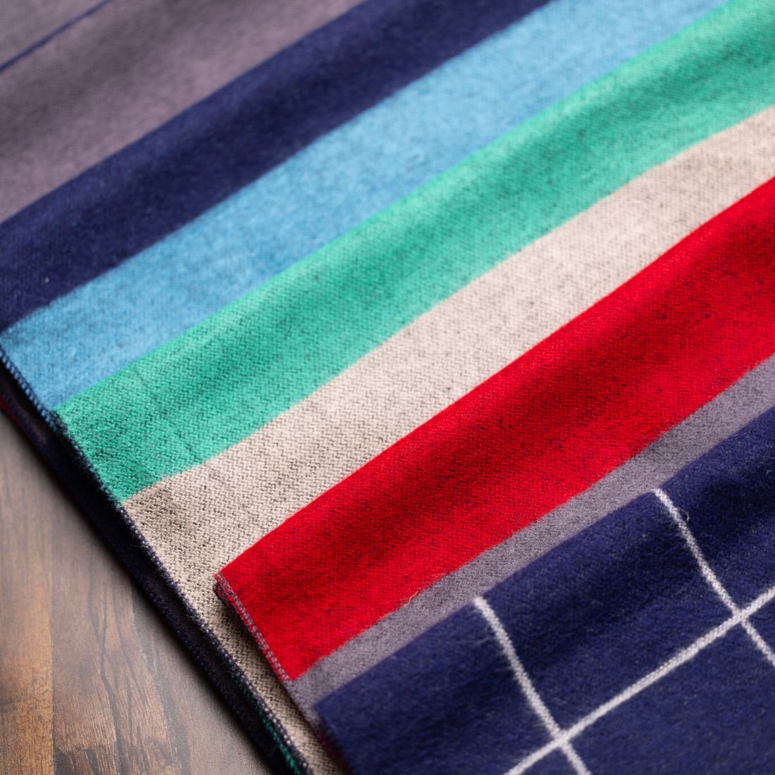 Colorful striped rug on a wooden floor