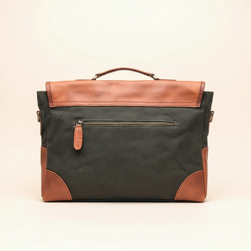 Green and brown leather briefcase on a beige background