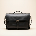 Black leather briefcase on a beige background