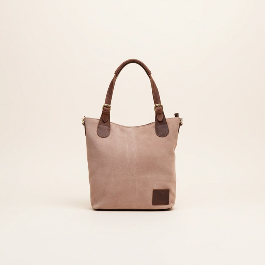 Beige tote bag with brown handles on a beige background