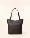Black leather handbag on a beige background