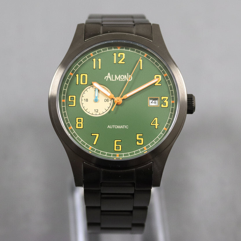 Green watch with black strap on a gray background