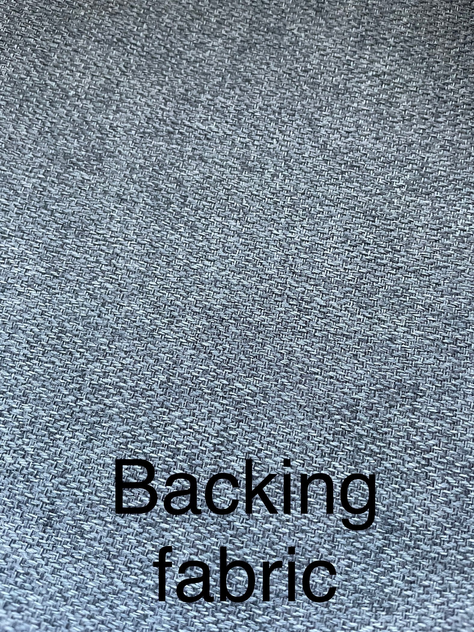 Close-up of gray textured fabric with 'Backing fabric' text overlay