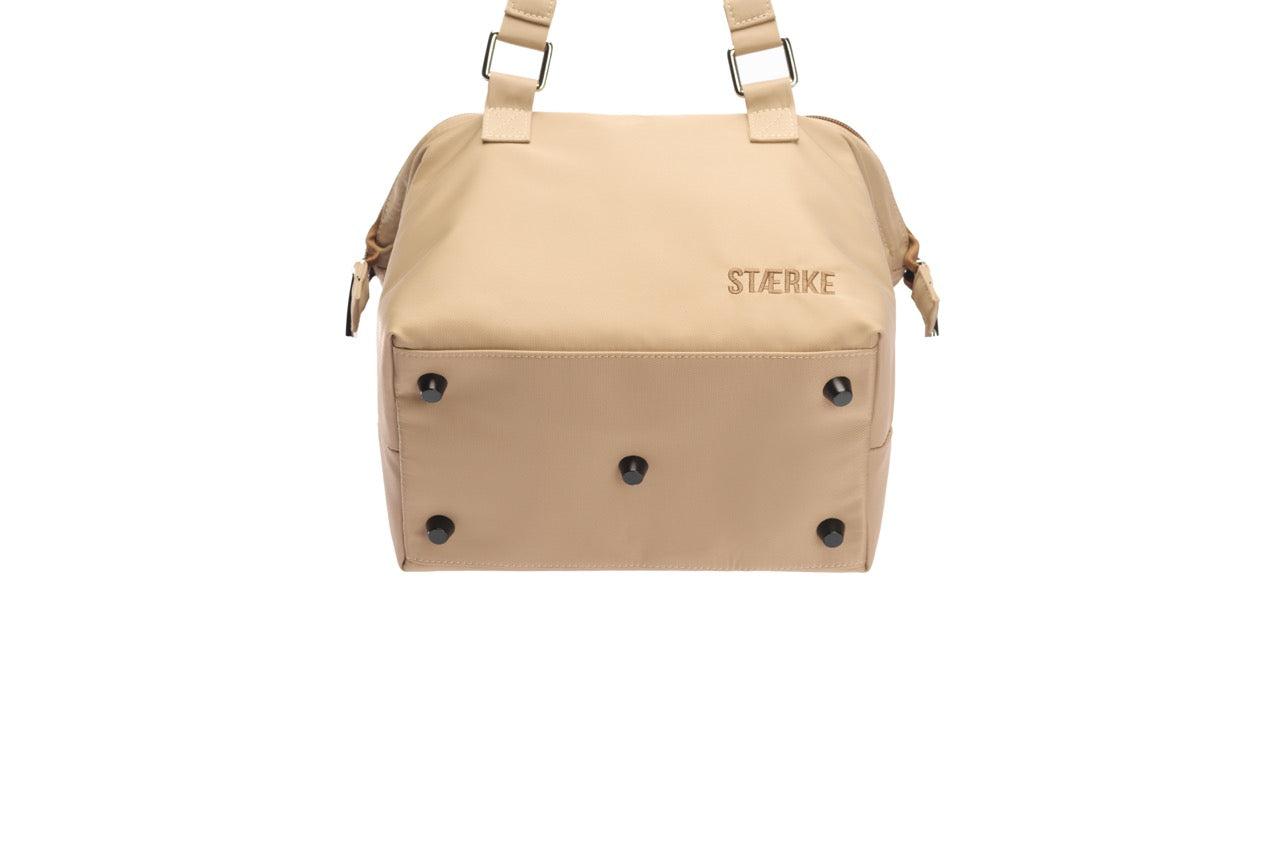Beige bag with 'Storke' branding on a white background