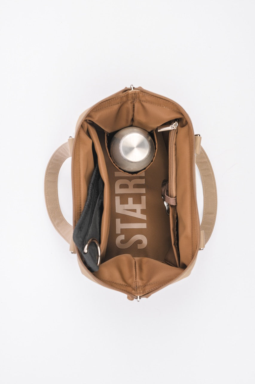 Brown bag with a Stäré logo on a white background