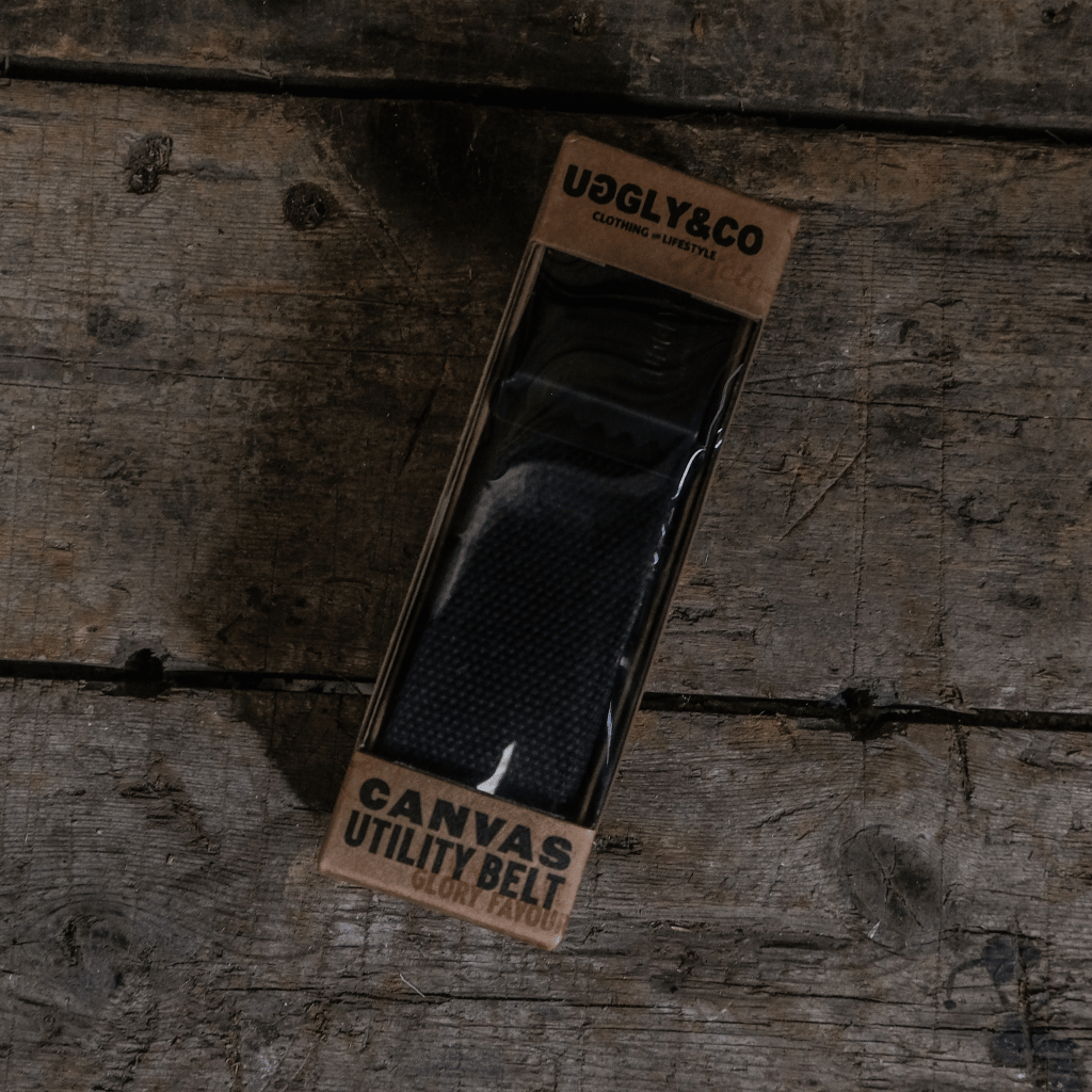 Canvas utility belt in packaging on a wooden surface