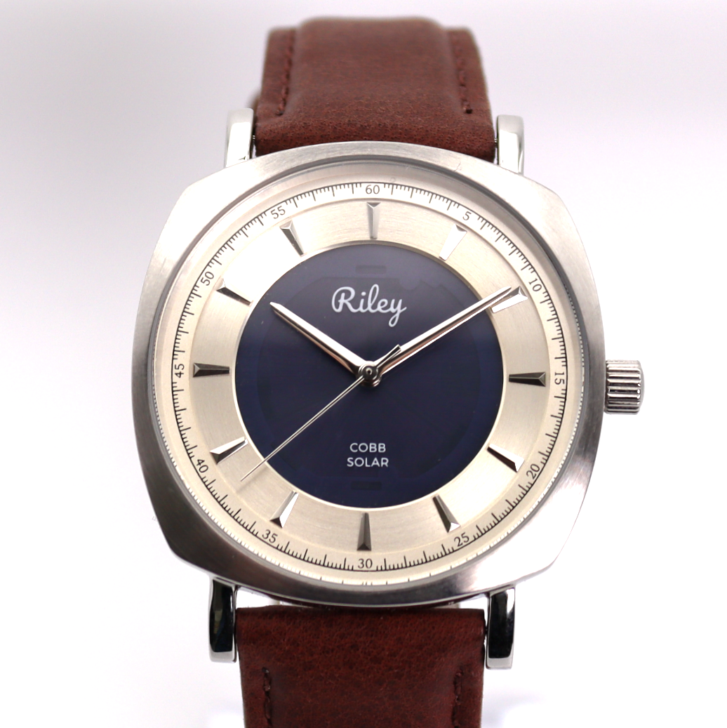 Wristwatch with brown leather strap and silver case on a white background