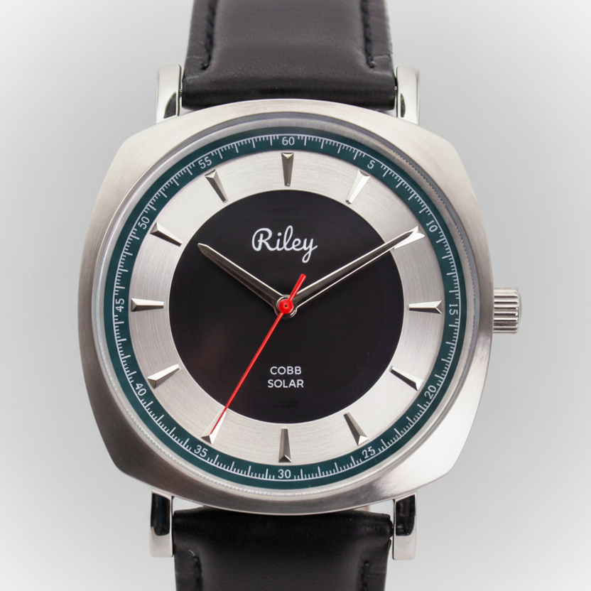 Wristwatch with black strap and silver case on a white background
