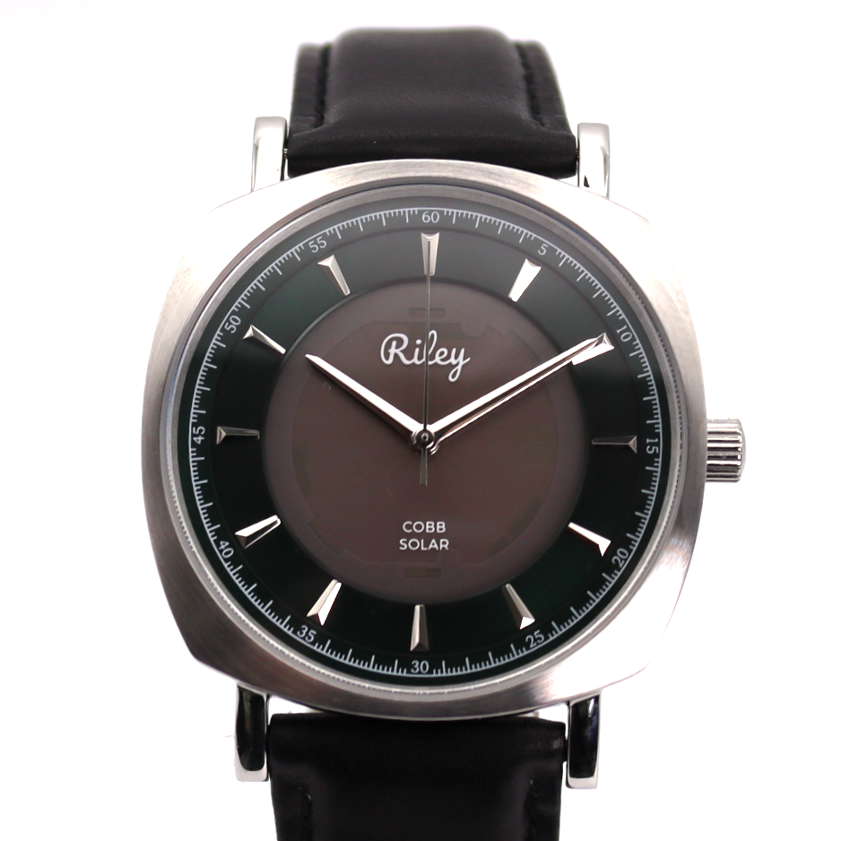 Wristwatch with black strap and brown face on a white background