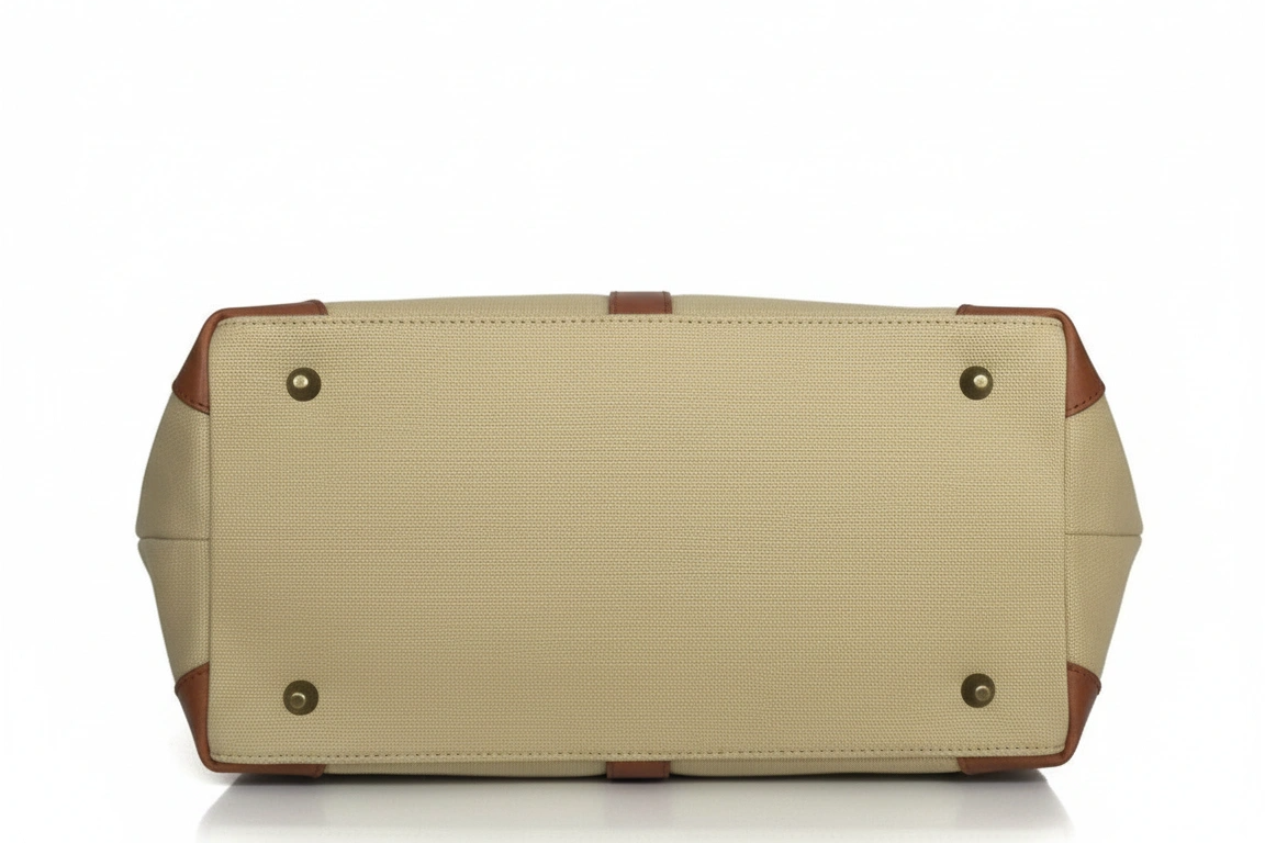 Beige handbag with brown accents on a white background