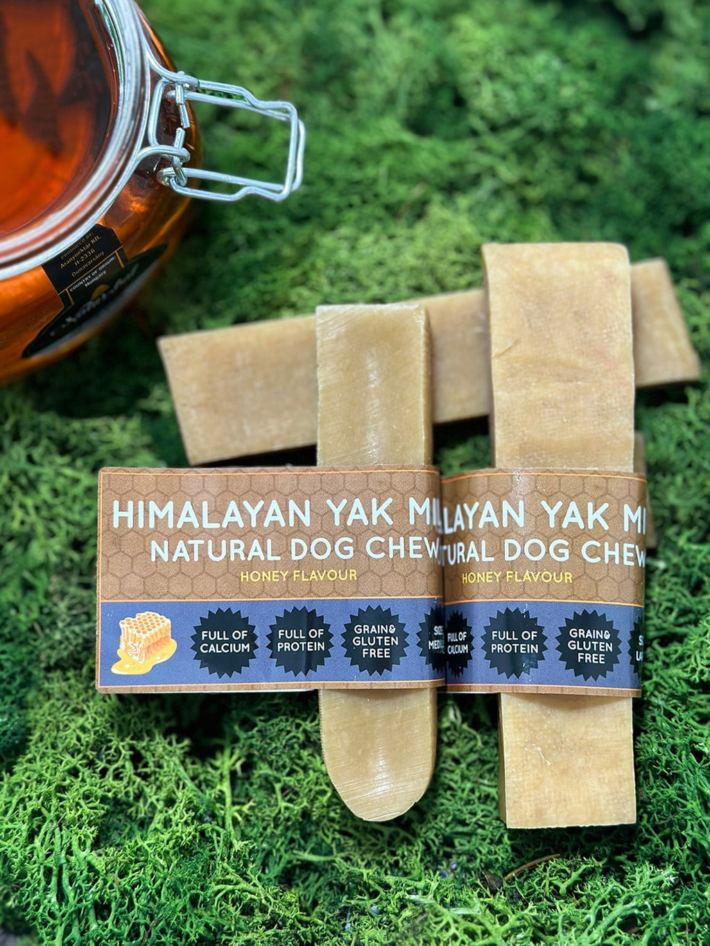 Himalayan Yak Natural Dog Chew packaging on a green moss background