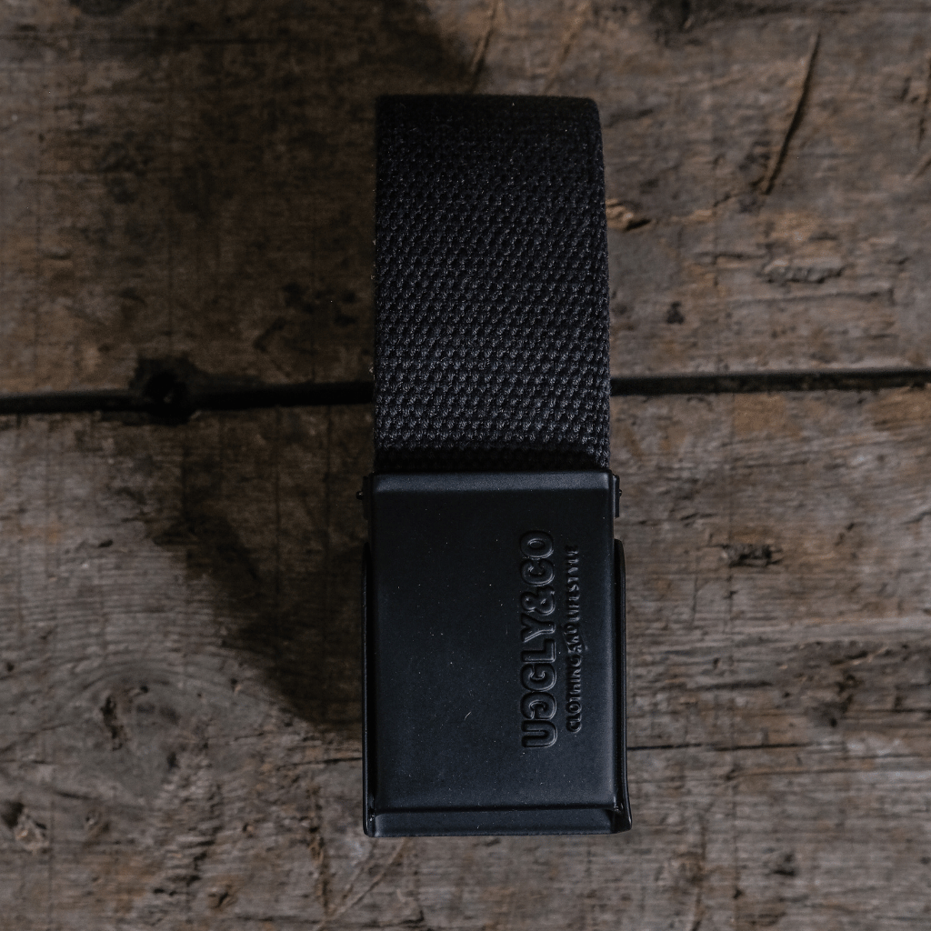 Black belt buckle on a wooden surface