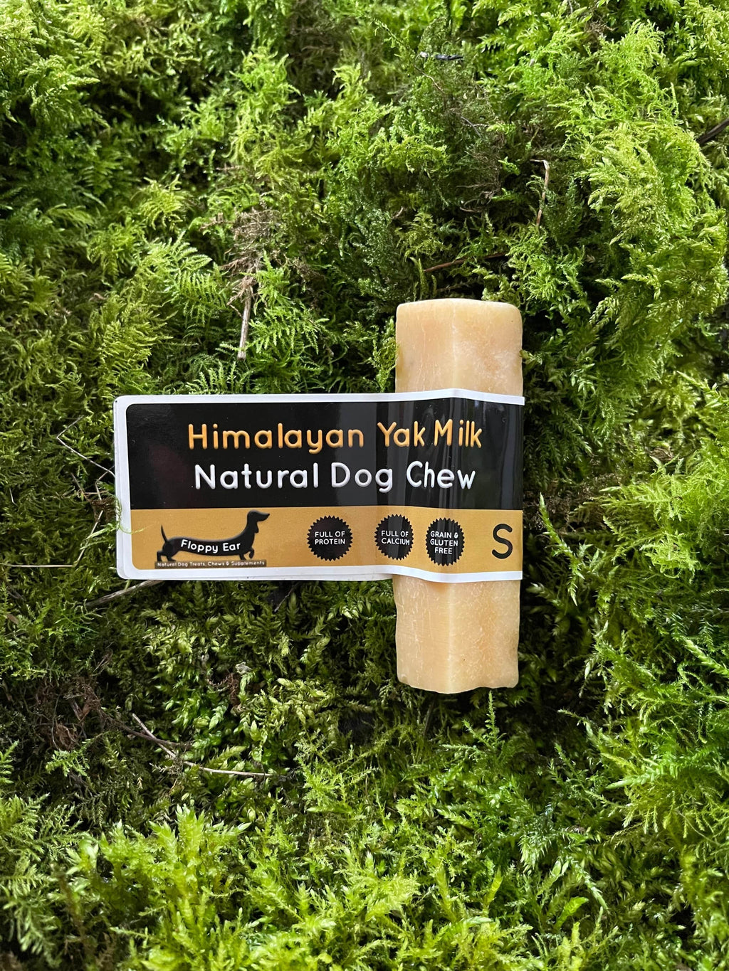 Himalayan Yak Milk Natural Dog Chew on a green moss background