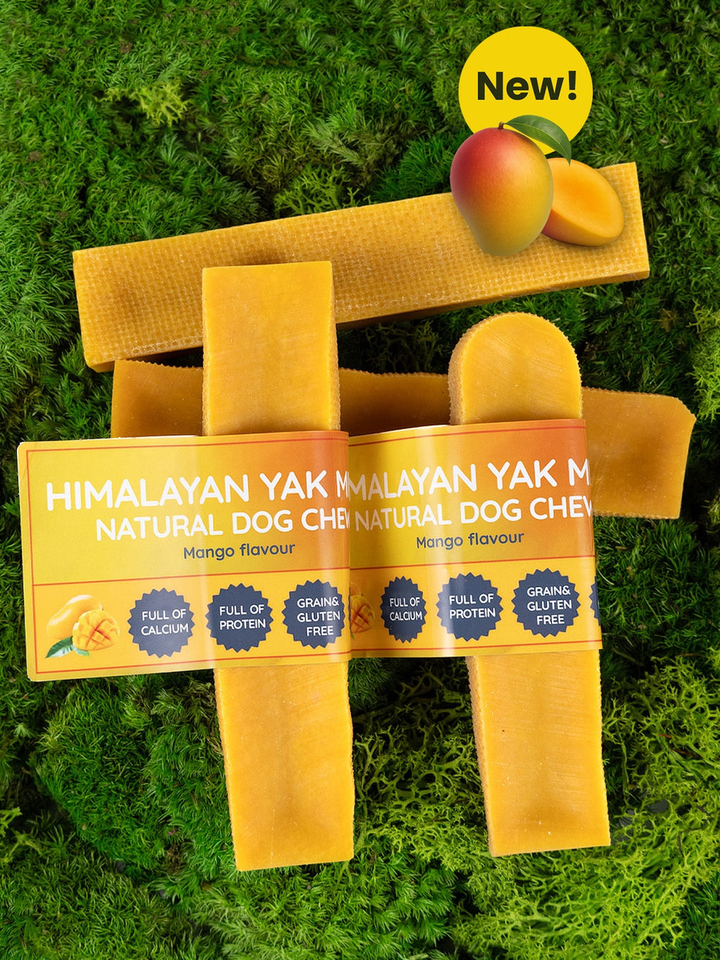 Himalayan Yak Natural Dog Chews packaging on grass with mangoes.