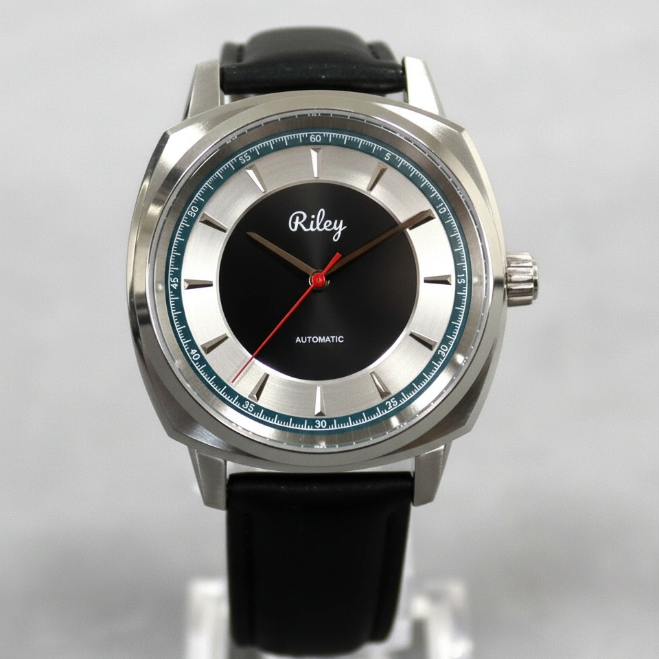 Wristwatch with black strap and silver case on a light gray background