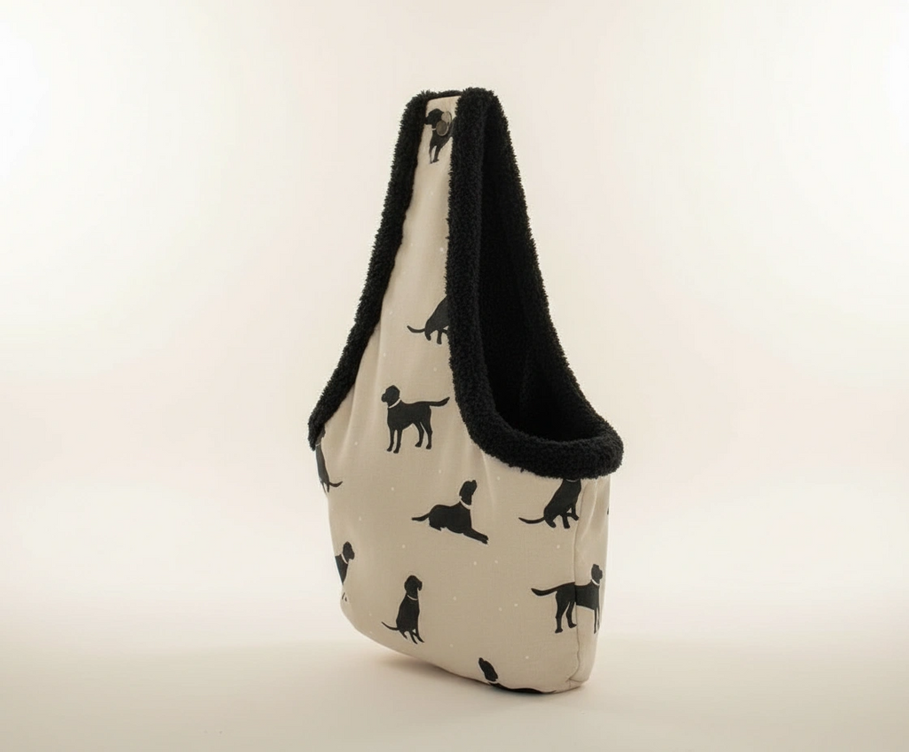 Fabric bag with black dog patterns on a beige background