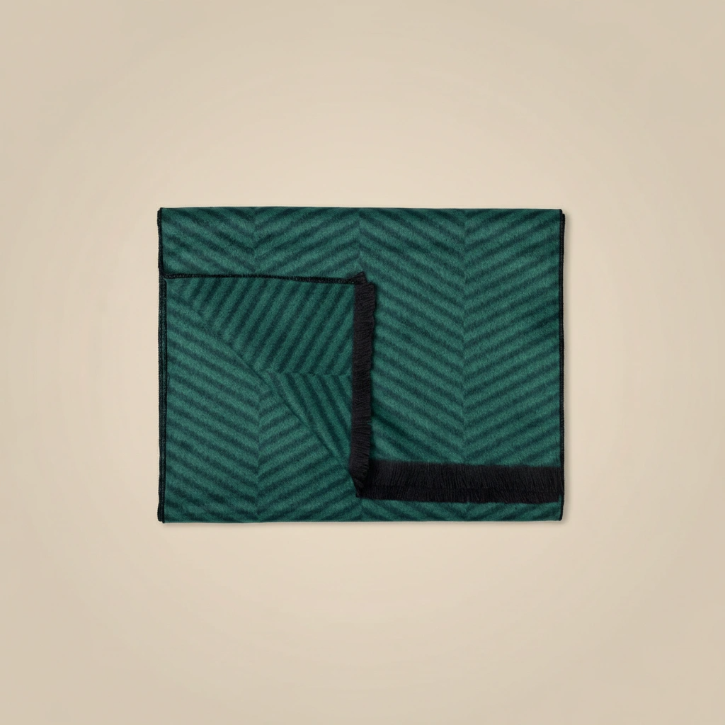Green and black patterned fabric on a beige background