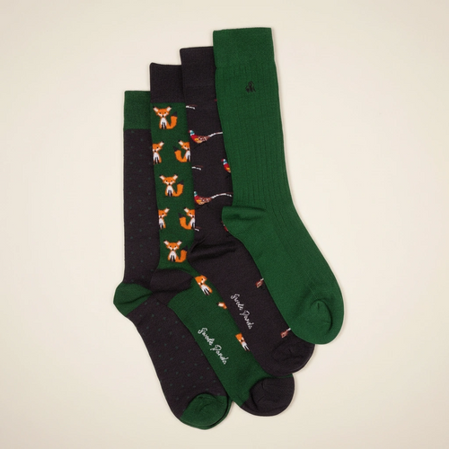 Set of four socks with fox pattern on a beige background