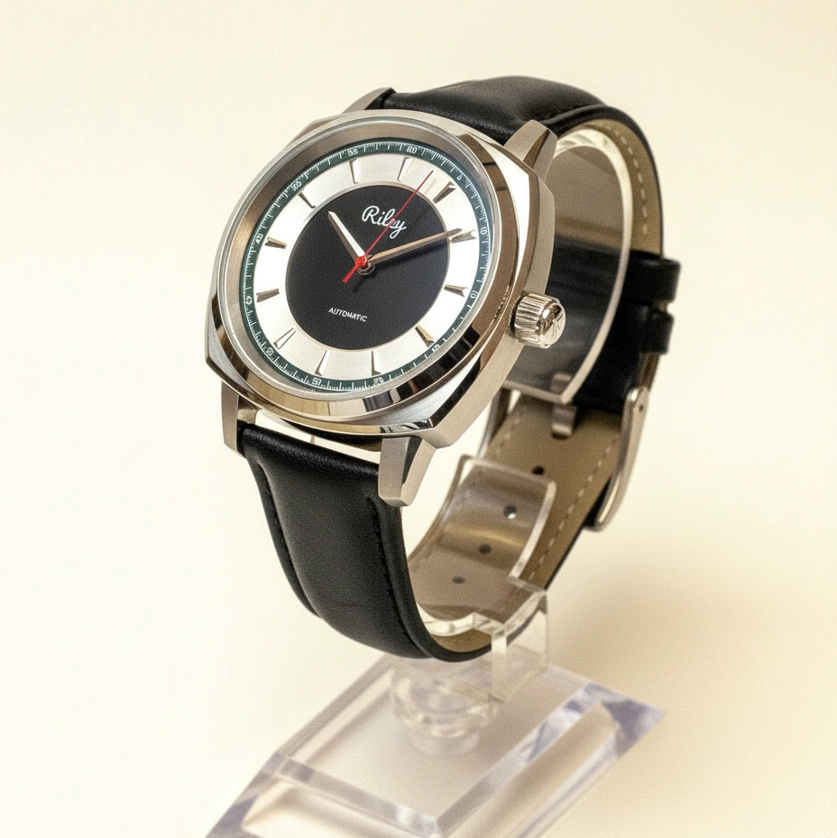 Wristwatch with black leather strap and silver case on a stand against a beige background