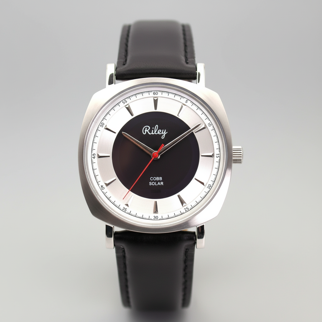 Wristwatch with black leather strap and silver case on a gray background