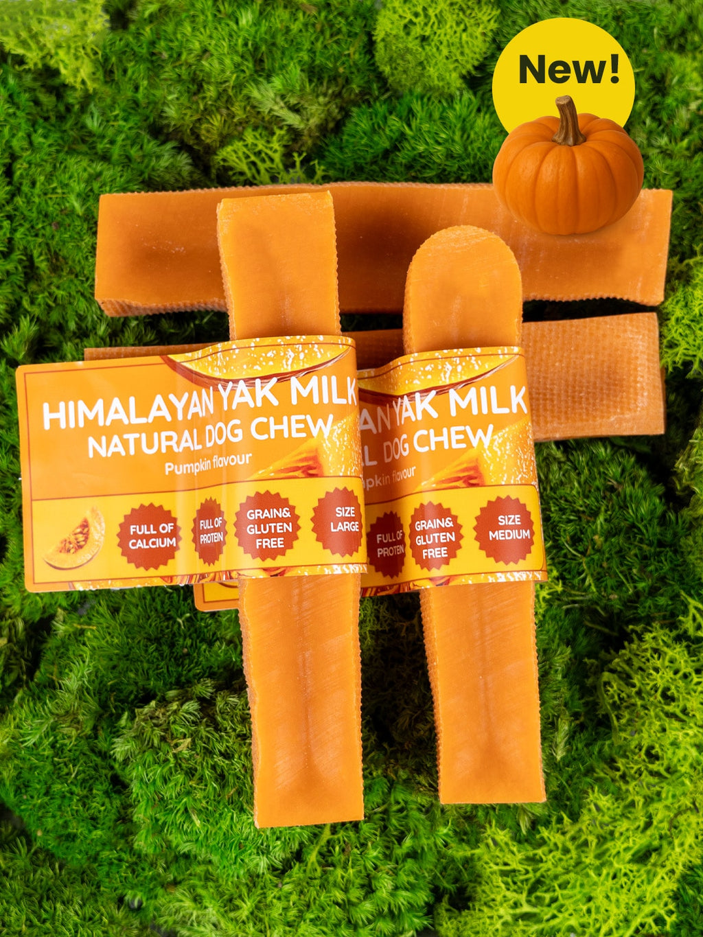 Himalayan Yak Milk Natural Dog Chew packaging on a grass background with a pumpkin and 'New!' label.