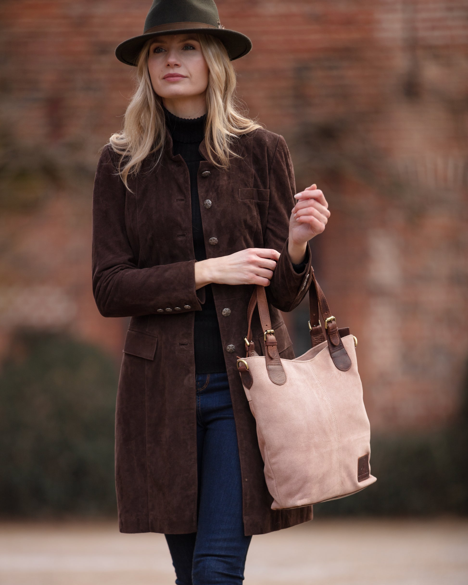 Dusky pink suede and dark brown leather handbag in classic English country style with adjustable shoulder straps and handles. Handmade from full grain vegetable tanned cow leather.