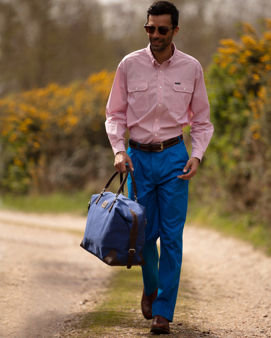 Handmade blue cotton canvas and vegetable tanned leather holdall by Burghley Bags.