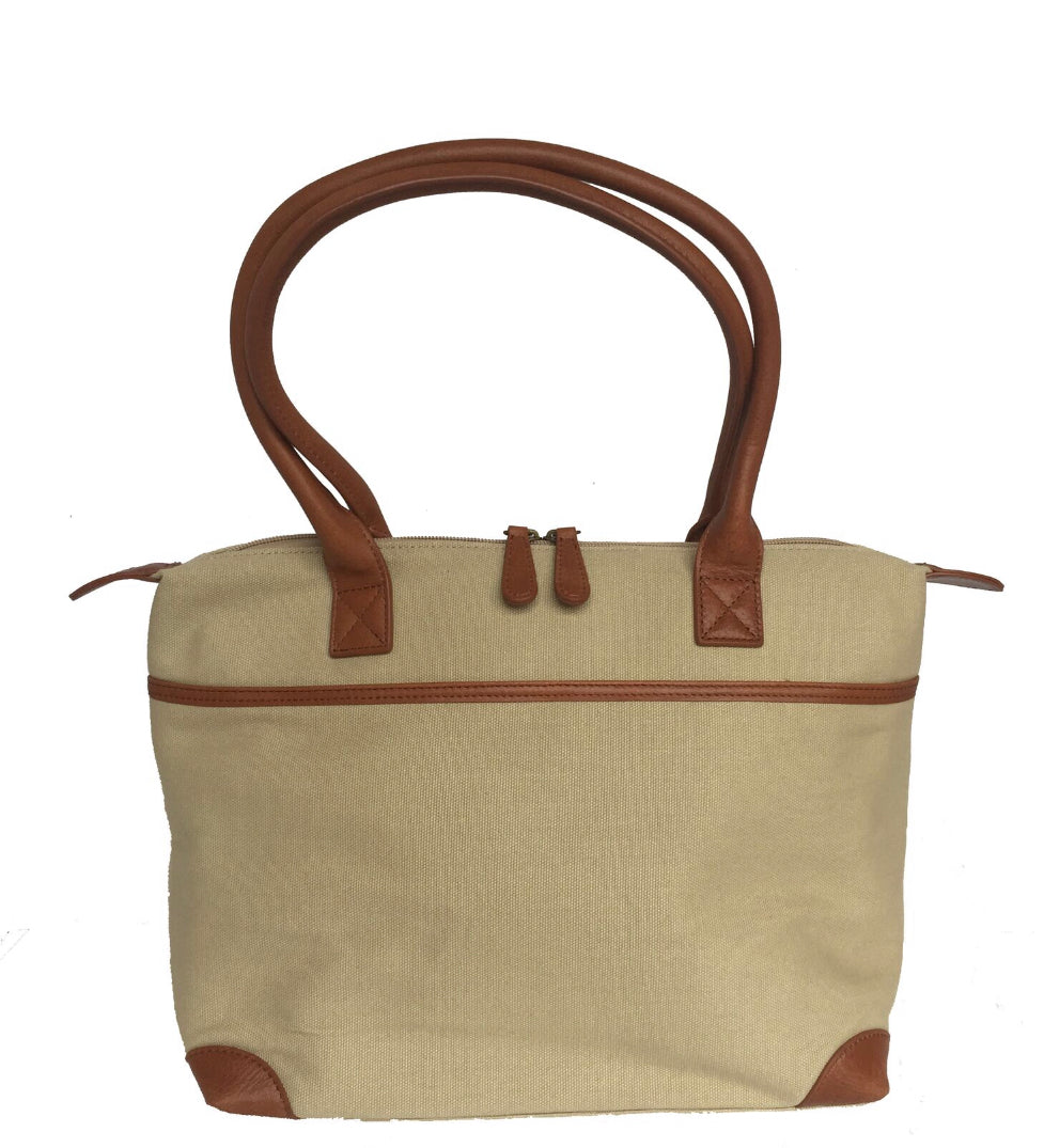 The Sedgebrook Handbag.  A classic and timeless bag by Burghley Bags.  Handmade from strong cotton canvas and leather. With strong leather handles it can be used as a shoulderbag. Shown in elegant cream.