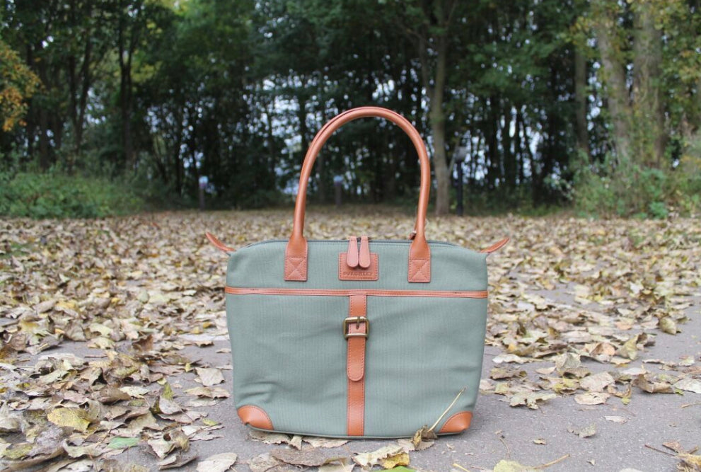 The Sedgebrook Handbag.  A classic and timeless bag by Burghley Bags.  Handmade from strong cotton canvas and leather. With strong leather handles it can be used as a shoulderbag. Shown in soft green.
