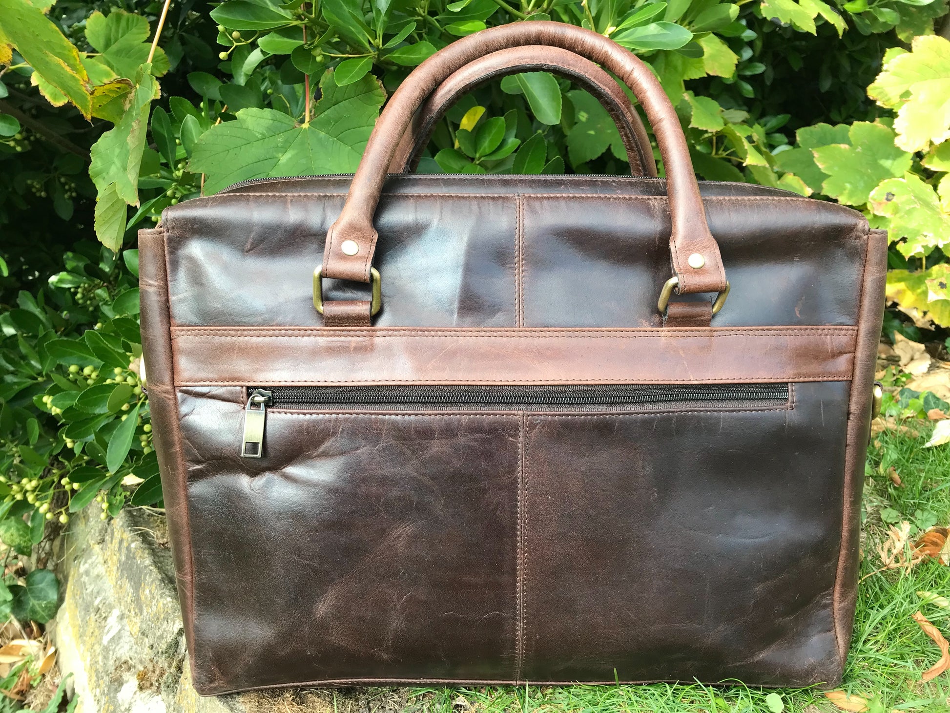 The Ashton. A handmade leather briefcase by Burghley Bags. Showing the back with zip pocket.