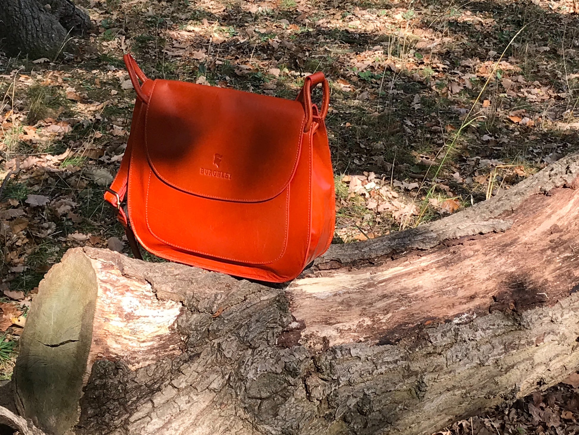 The Aunby Saddlebag.  A handmade leather bag by Burghley Bags in a vibrant burnt orange colour.