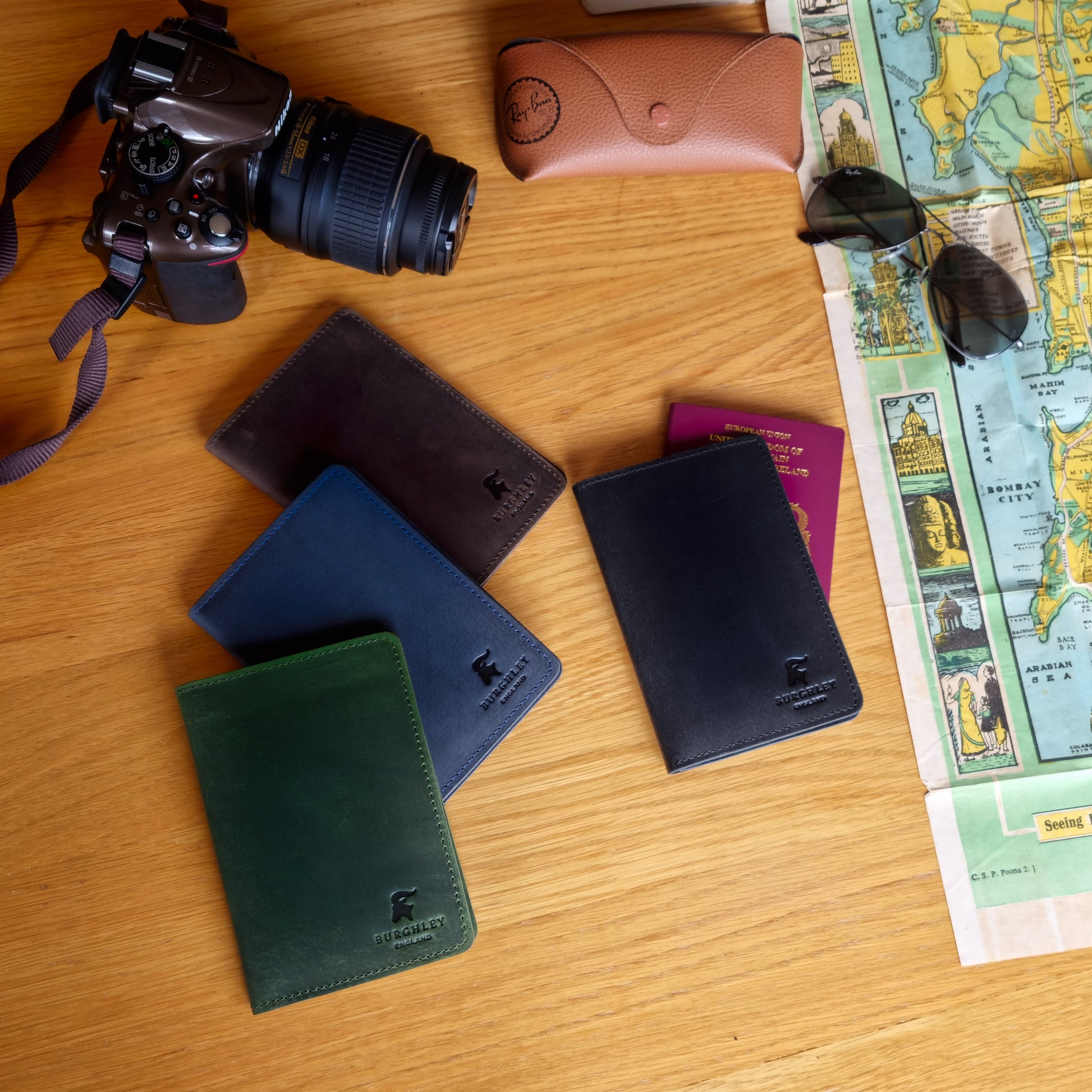 Handmade leather passport cover available in brown, blue, green, and black. Made from full grain cow leather.