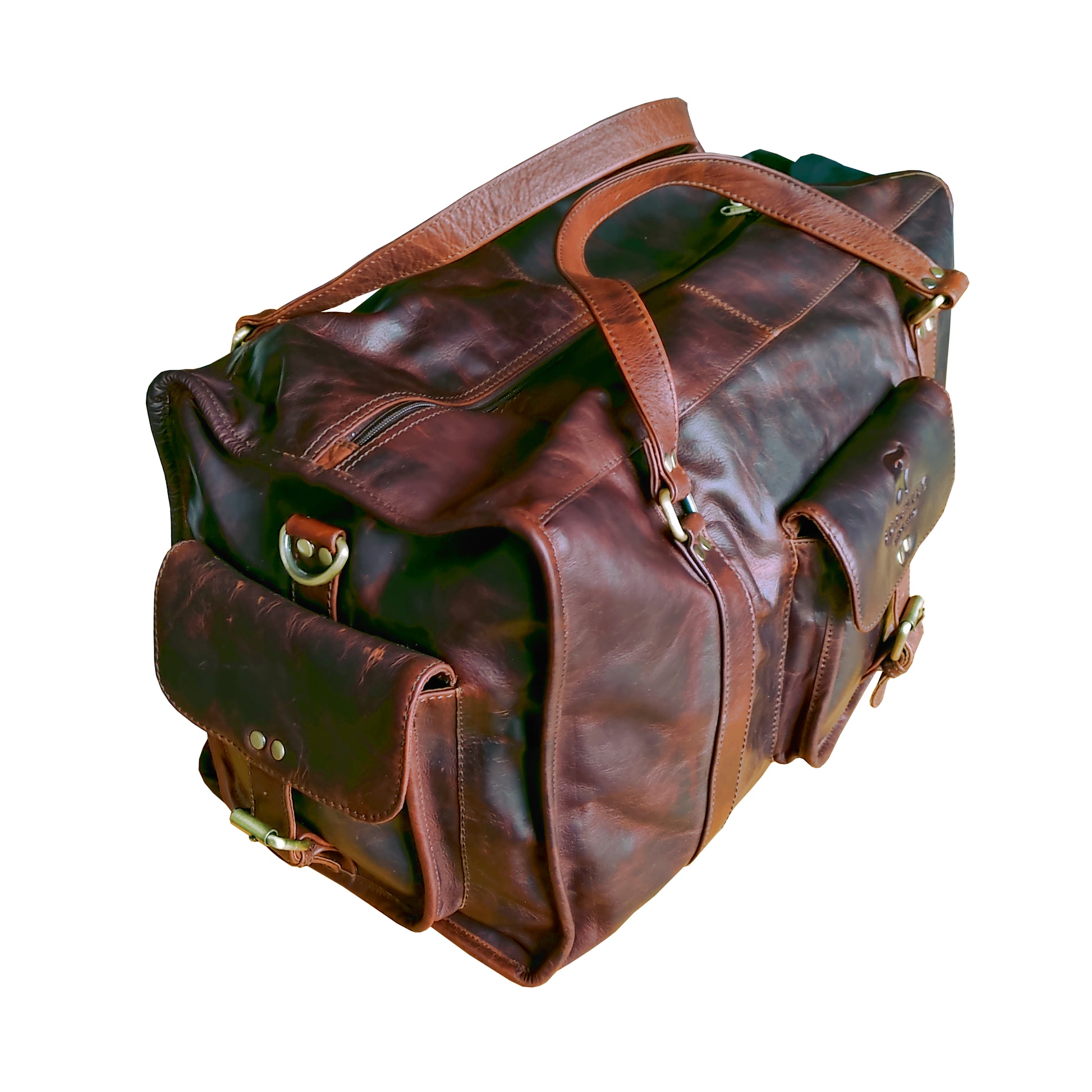 Brown full leather rugged holdall in classic English country style. Handmade from full grain vegetable tanned cow leather.