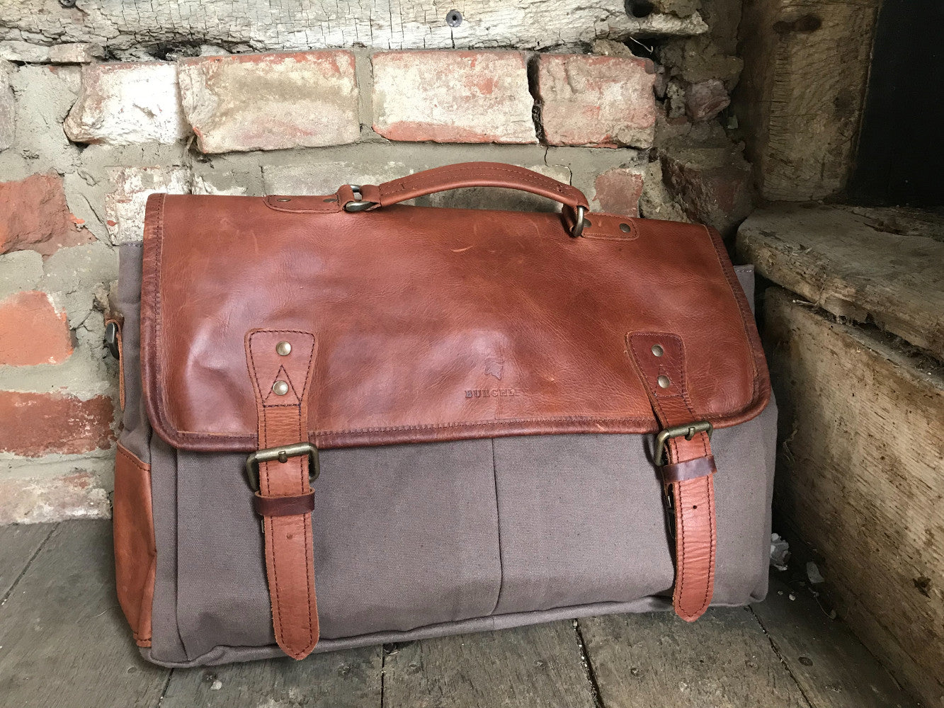 The Barholm. A contemporary handmade handmade leather and canvas briefcase by Burghley Bags. Canvas in soft grey with classic brown eco-friendly vegetable tanned leather.