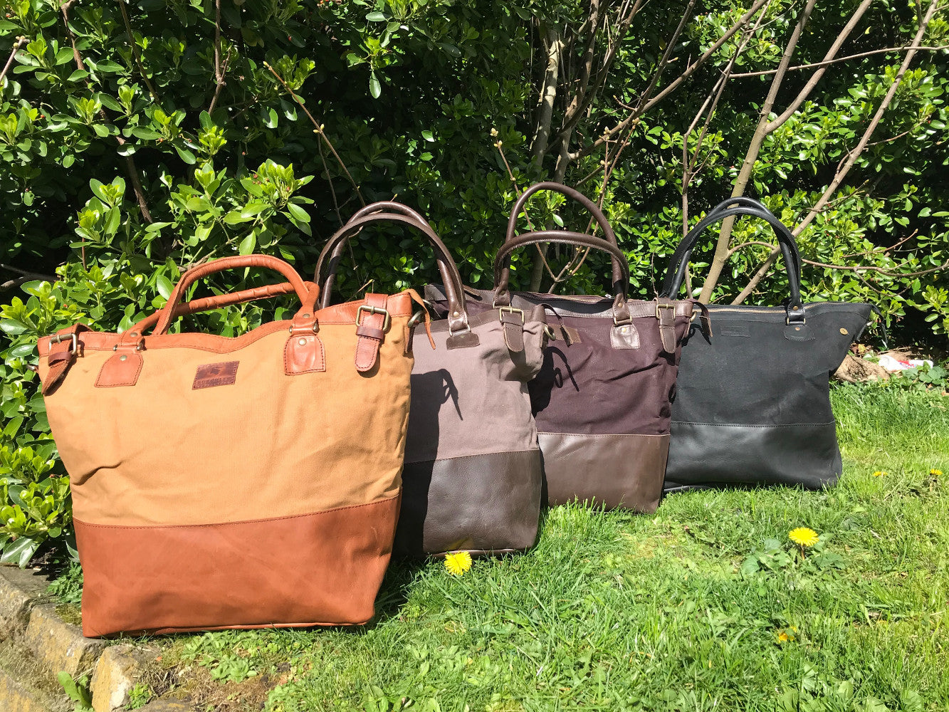 The Bingham.  A classic zipped tote bag by Burghley Bags.  Handmade from eco-friendly vegetable tanned leather and strong cotton canvas, with a leather shoulder strap.  Comes in a variety of colours.