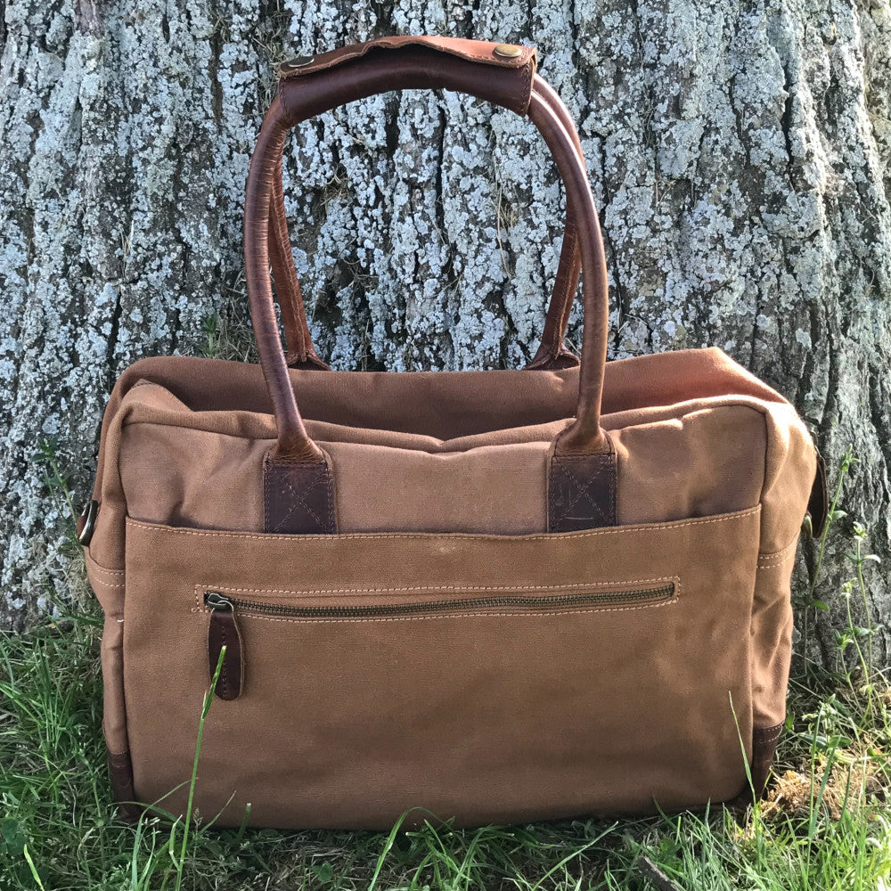 The Breton Briefcase. A casual work bag by Burghley Bags. Handmade from strong cotton canvas and supple leather.  Shown in classic tan.