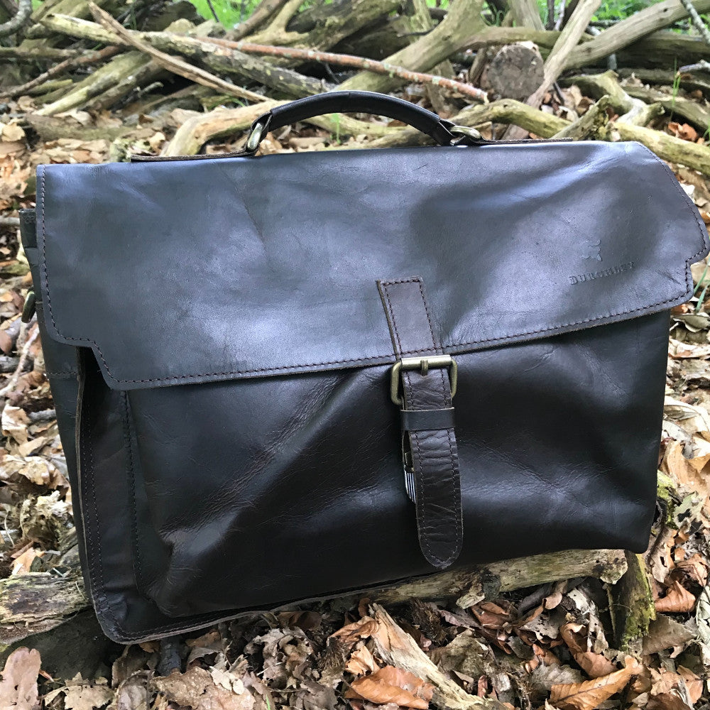 The Dorrington Briefcase. A classic 30's styled leather briefcase by Burghley Bags. A handmade leather vintage work bag, with enough space for 15" laptops. Comes with an adjustable and detachable shoulder strap. Shown in elegant black.