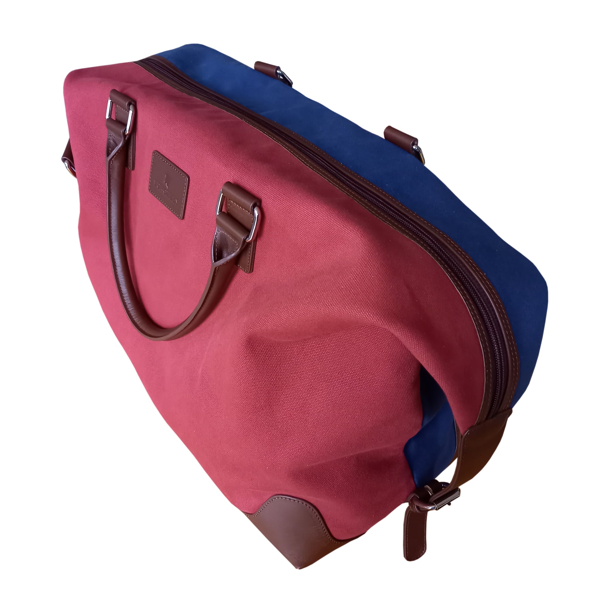 Handmade red and blue multi colour cotton canvas and vegetable tanned leather holdall by Burghley Bags.